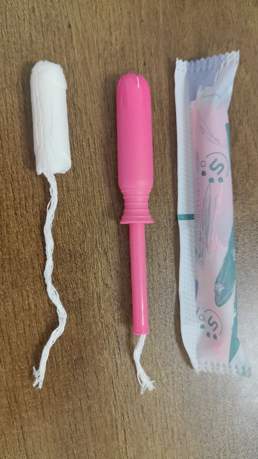 Plastic applicator tampons with pink applicator and individual wrapper, in stock